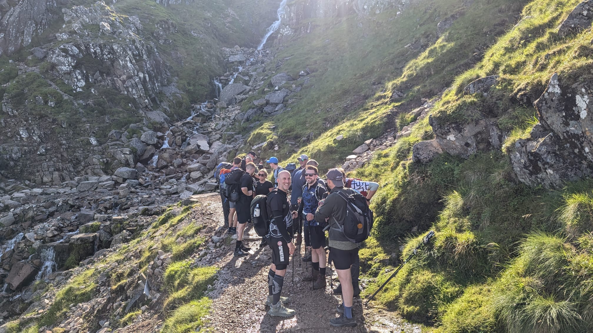 The team pause for a break whilst walking up Ben Nevis.